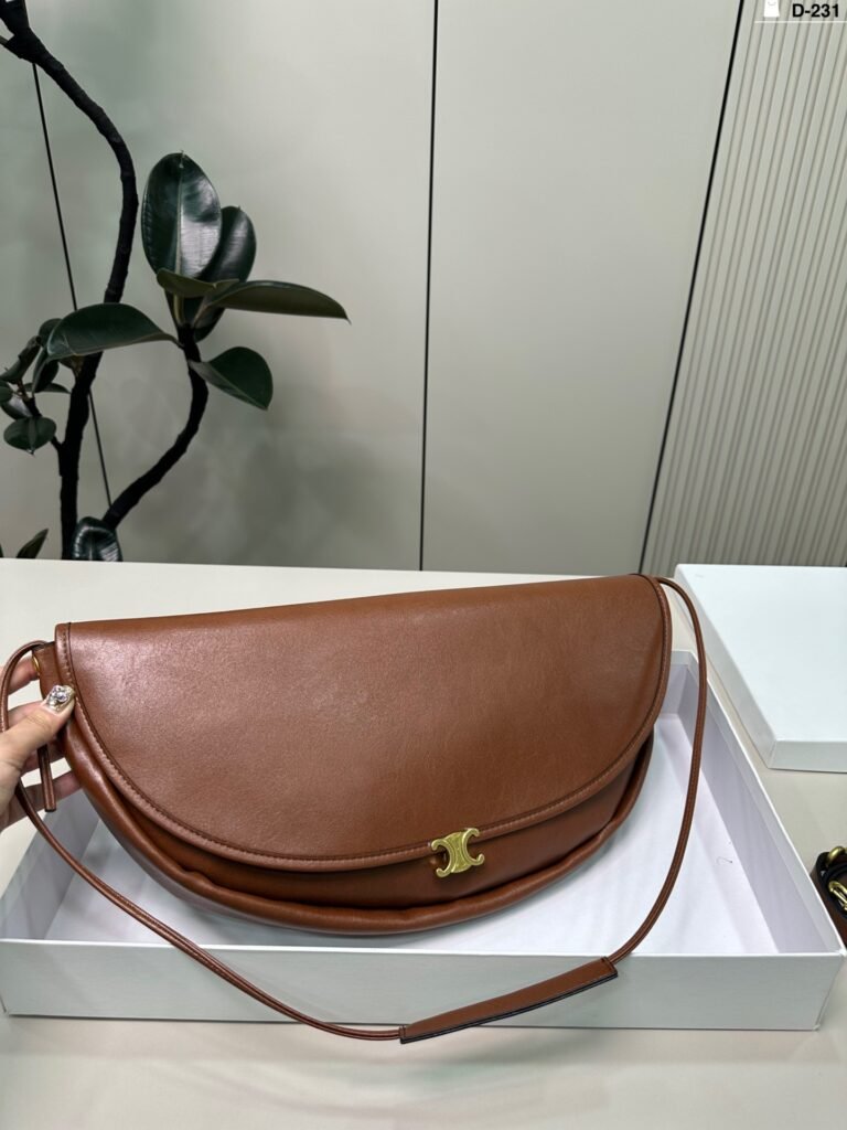 D-21 (Dimensions: 46 x 20 cm; box included) CELINE Soft Triomphe Half-Moon Bag